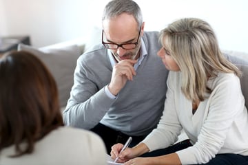 Senior couple meeting financial adviser for investment